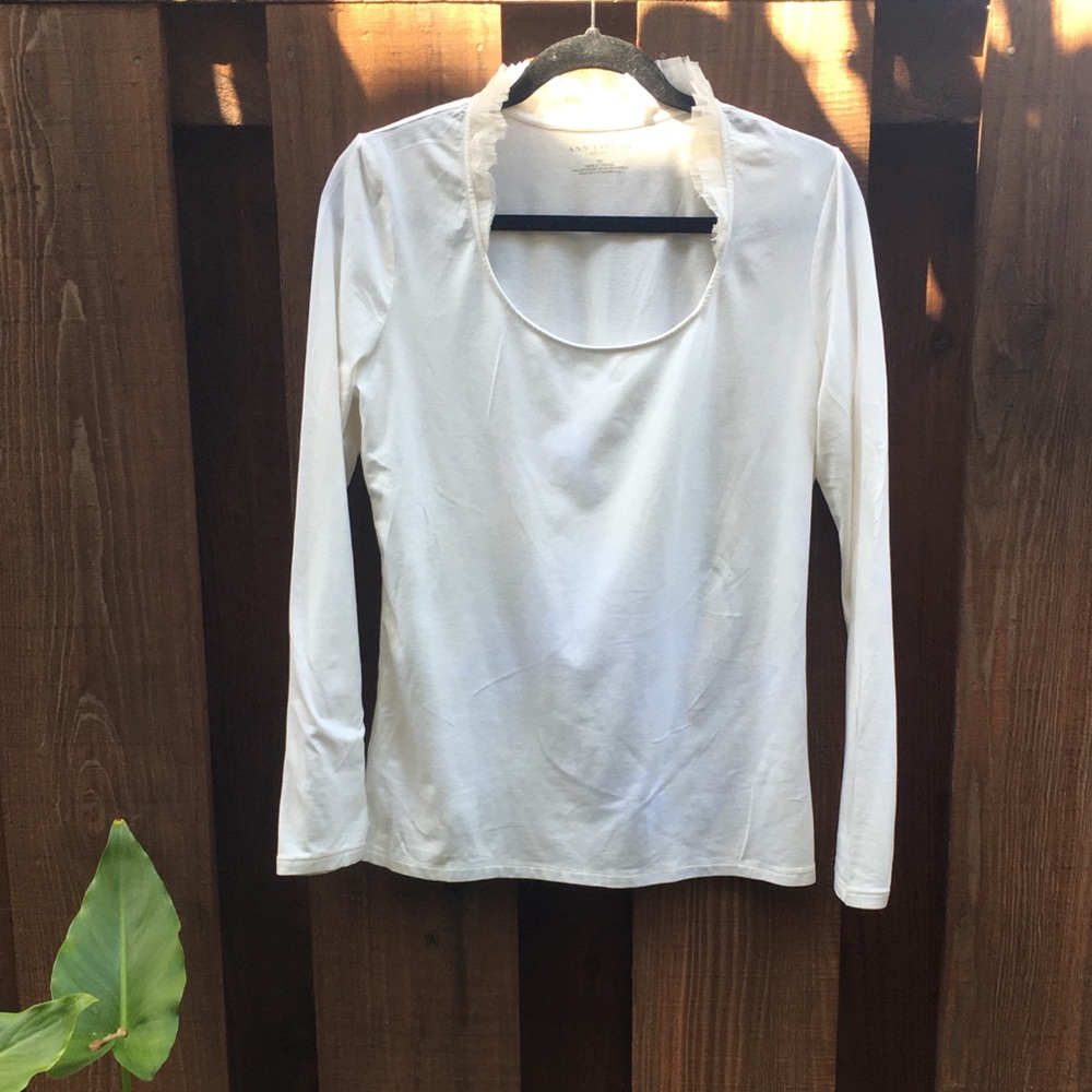 Elegant white knit top.